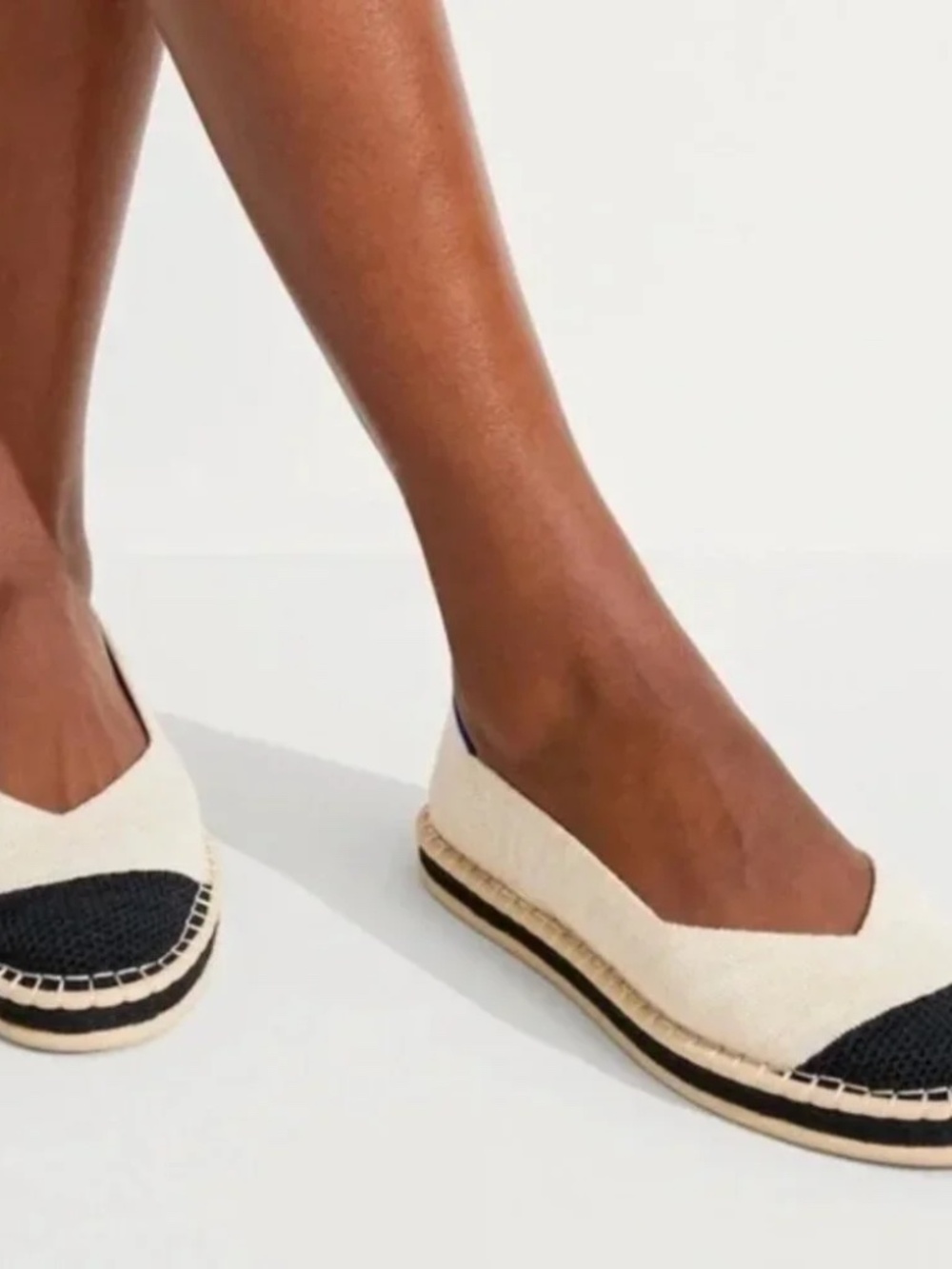Rothy's Cream Flats with Black Toe Caps